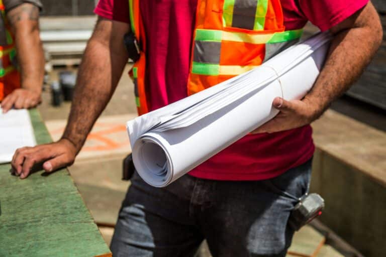 Skilled traveling electricians working on a large-scale industrial project